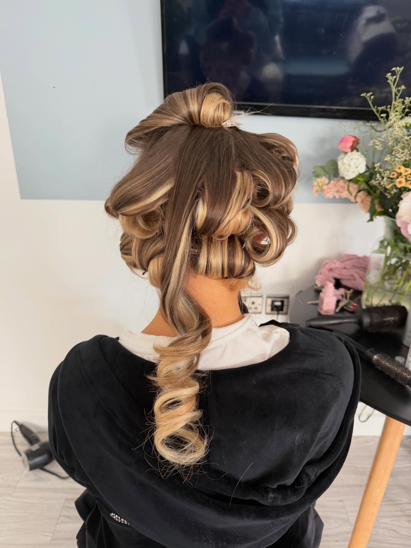Luxury glam blow dry with pinned curls and a polished event finish.
